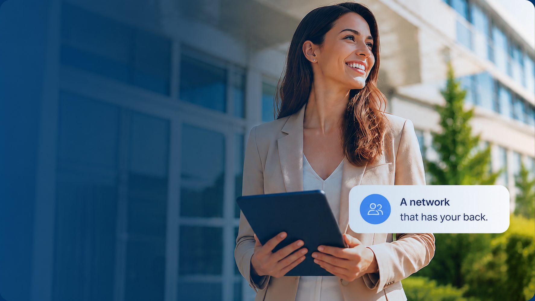 An Equity agent standing outside a modern office building with a tablet, beside a badge reading "A network that has your back."